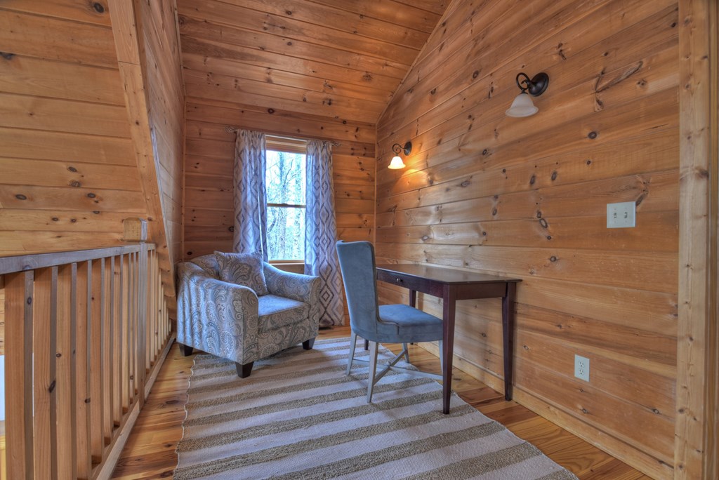 159 Squirrel Hunting Road Ellijay, GA 30536 - Photo 54 of 66 a view of a porch with furniture and wooden floor