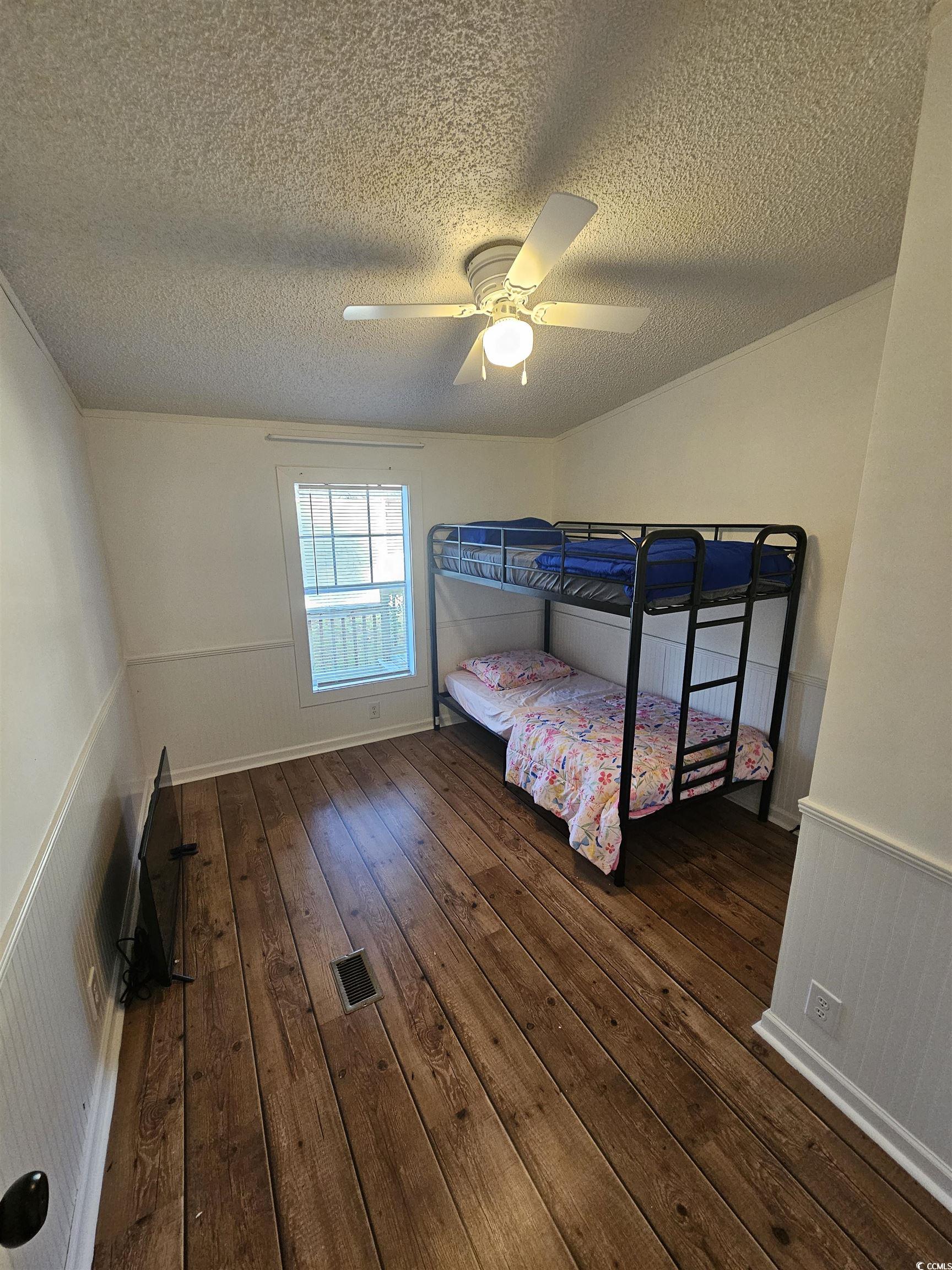 46 Islander Court Murrells Inlet, SC 29576 - Photo 11 of 14 Bedroom with ceiling fan, dark wood-type flooring,