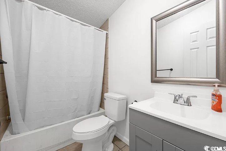 46 Islander Court Murrells Inlet, SC 29576 - Photo 12 of 14 Full bathroom with tile patterned flooring, a text