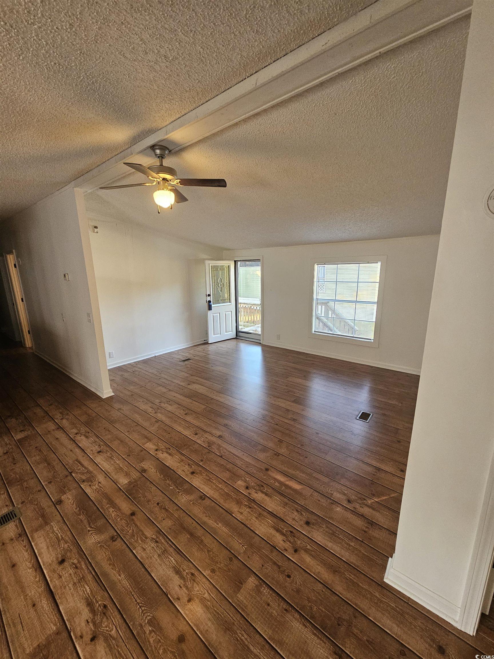 46 Islander Court Murrells Inlet, SC 29576 - Photo 6 of 14 Unfurnished room with ceiling fan, dark wood-type