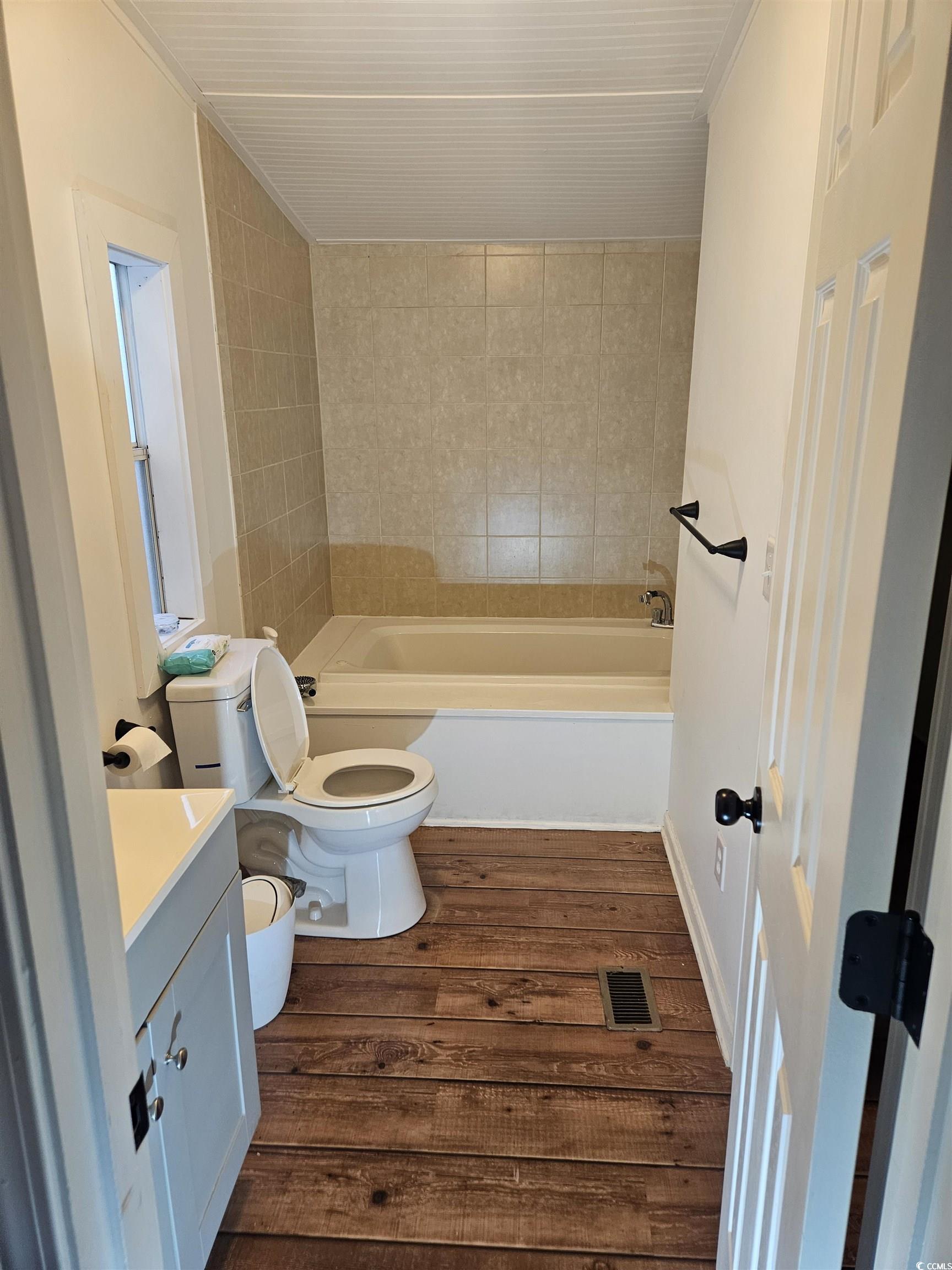 46 Islander Court Murrells Inlet, SC 29576 - Photo 9 of 14 Bathroom featuring a tub to relax in, vanity, hard
