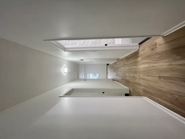 a bathroom with a sink mirror and vanity