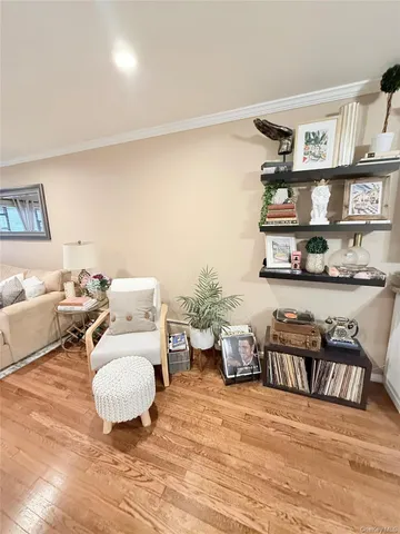 a room with furniture or wooden floor and a book shelf