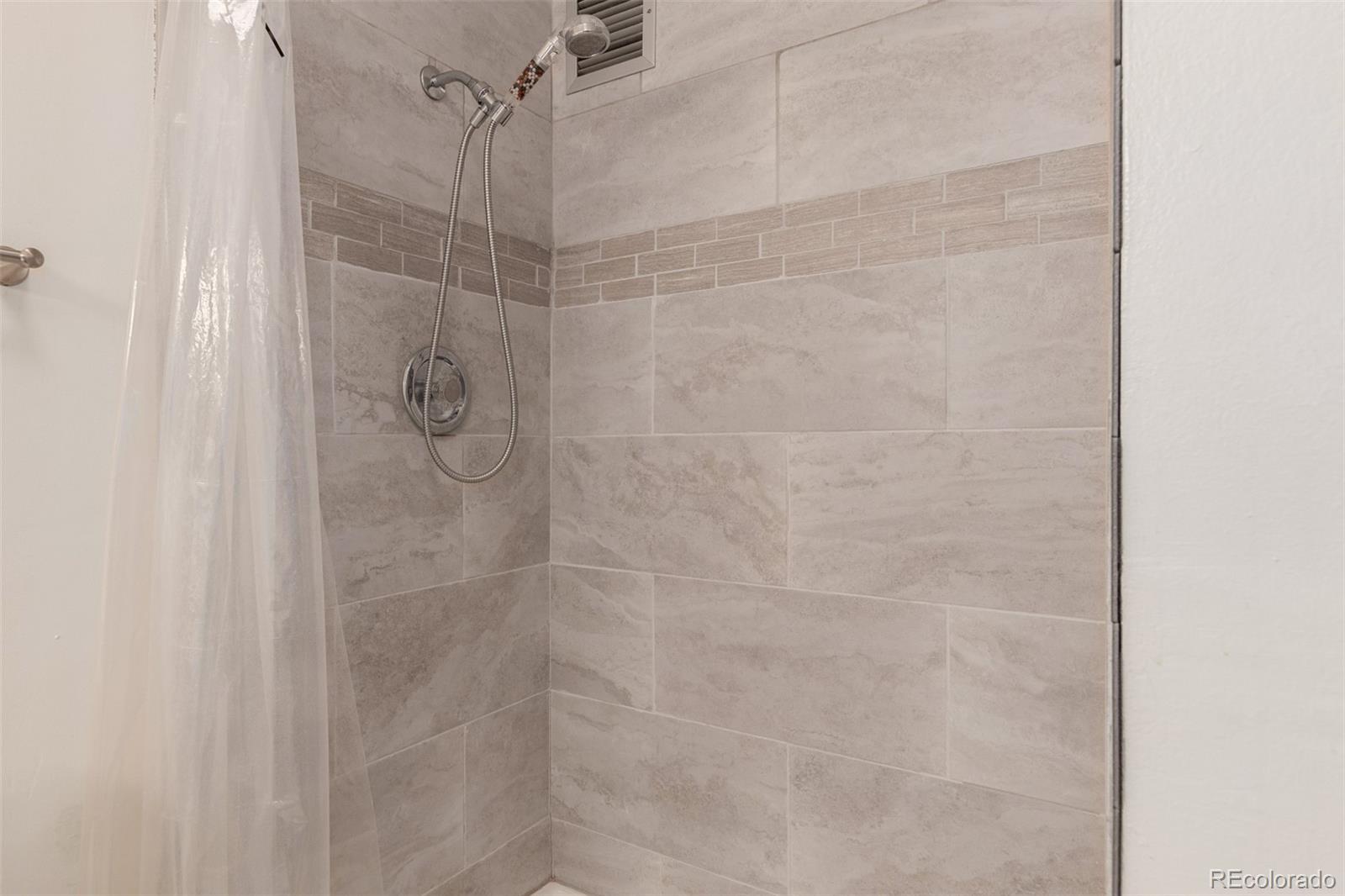 725 South Clinton Street, Unit 7B Denver, CO 80247 - Photo 21 of 29 a bathroom with a shower