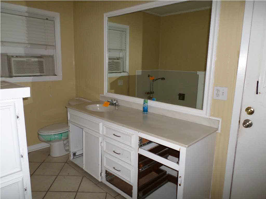 2429 Nottingham Road Jackson, MS 39211 - Photo 15 of 19 Master Her bathroom with tub and vanity