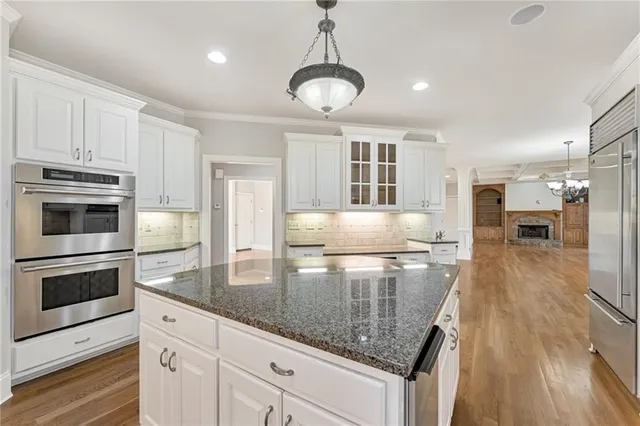 a kitchen with counter top space cabinets and stainless steel appliances