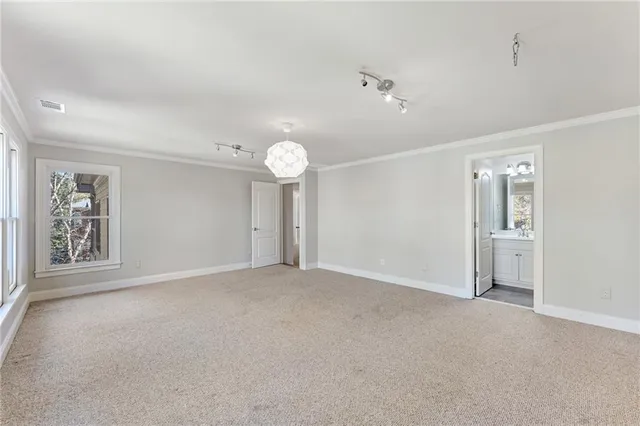 a bathroom with a granite countertop sink a toilet and shower