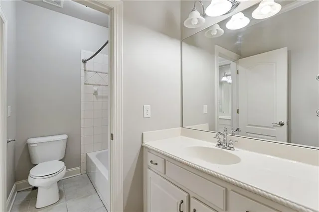 a bathroom with a sink a mirror and a shower
