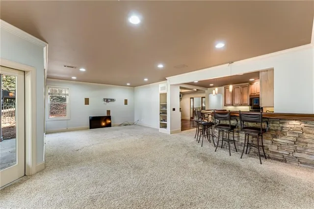 a view of a dining room with furniture and window