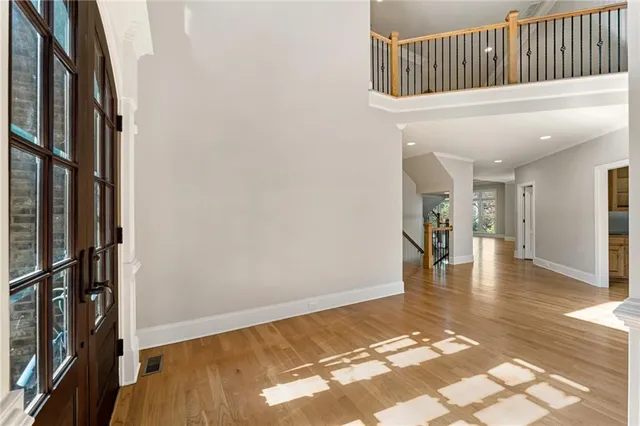 a view of an entryway with wooden floor