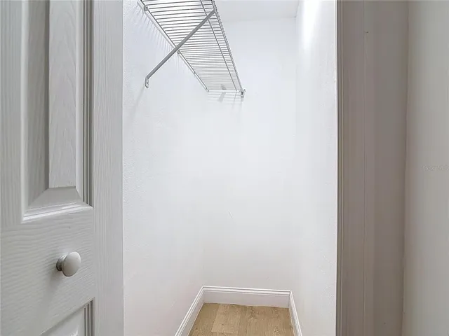 a bathroom with a toilet a sink a vanity and mirror