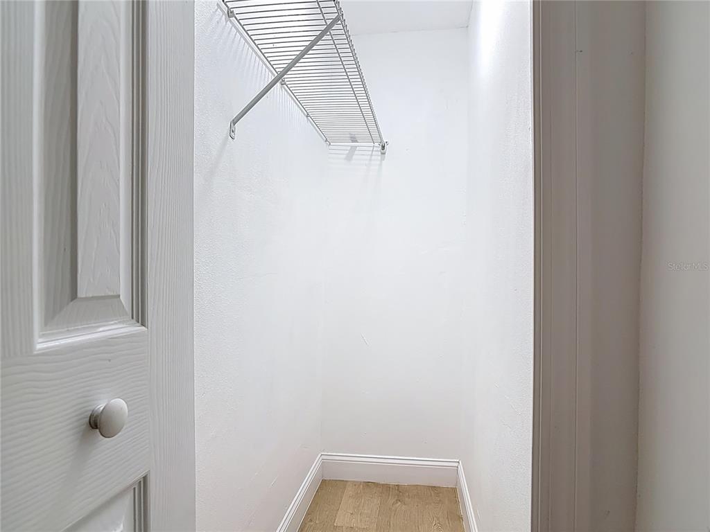 2410 SW Road Sanford, FL 32771 - Photo 19 of 30 a view of small space with racks on the wall