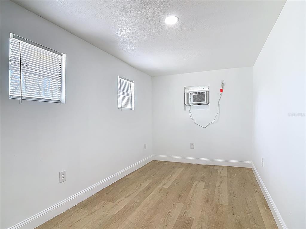 2410 SW Road Sanford, FL 32771 - Photo 22 of 30 an empty room with a workbench