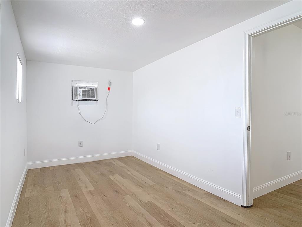 2410 SW Road Sanford, FL 32771 - Photo 23 of 30 an empty room with a workbench