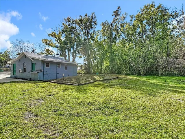 a view of outdoor space with deck and yard