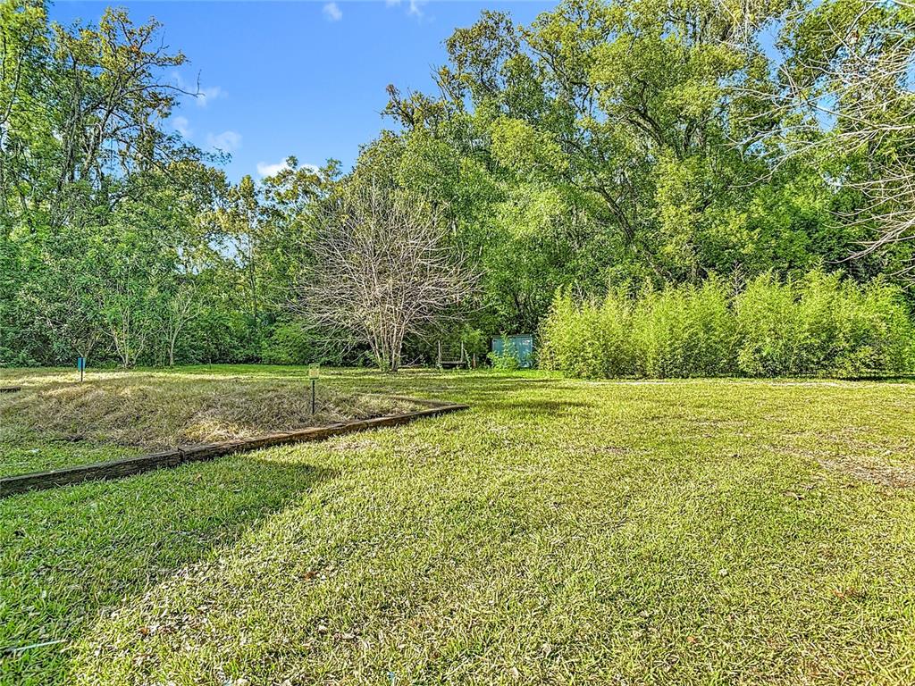 2410 SW Road Sanford, FL 32771 - Photo 29 of 30 a view of outdoor space with deck and yard