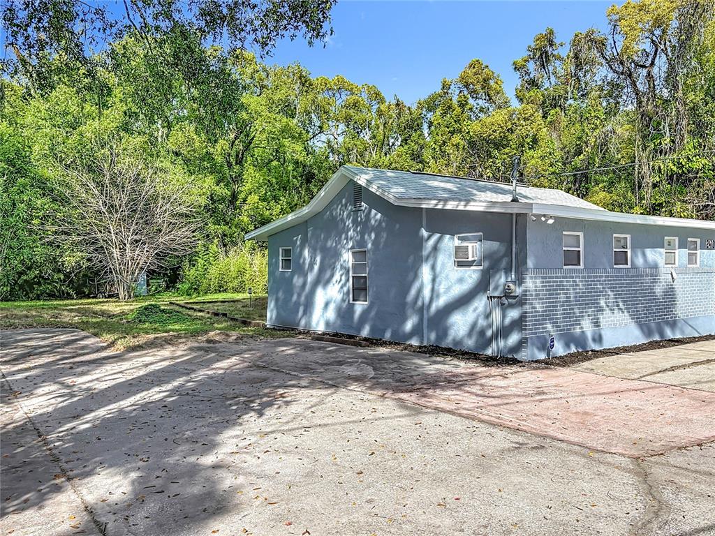 2410 SW Road Sanford, FL 32771 - Photo 3 of 30 a view of a house with a yard