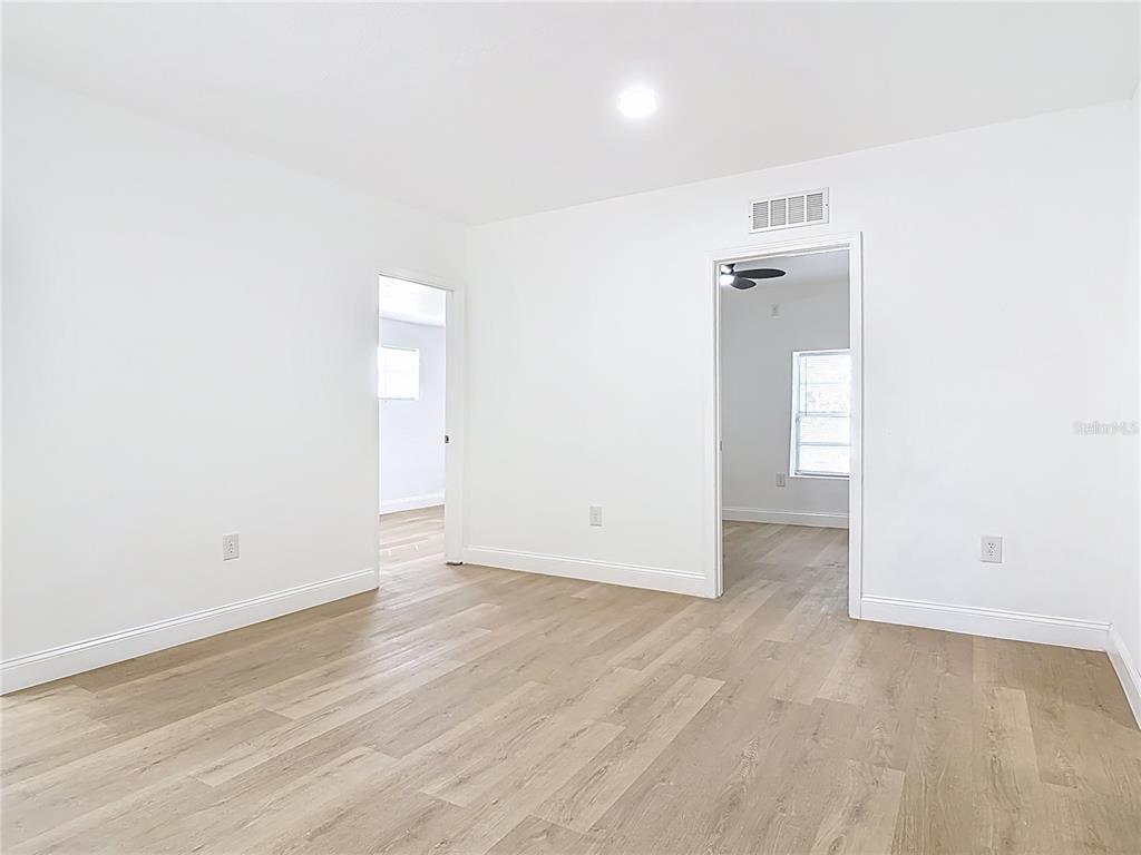 2410 SW Road Sanford, FL 32771 - Photo 9 of 30 an empty room with wooden floor