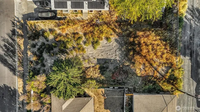 an aerial view of multiple houses with yard