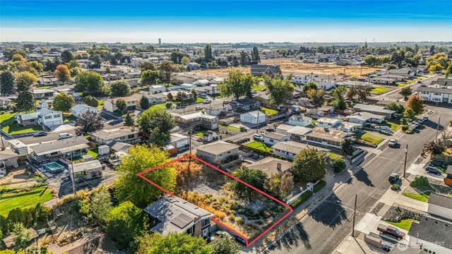 an aerial view of a city with parking space