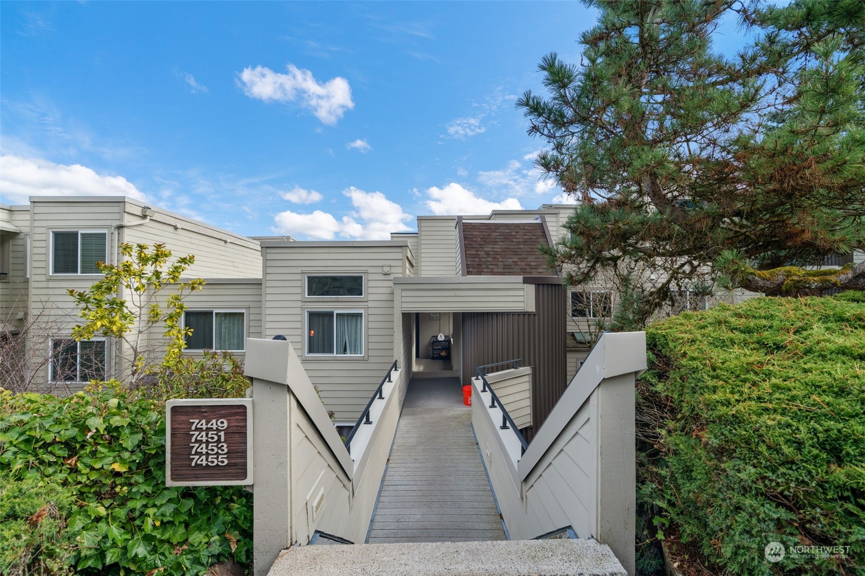 7455 Old Redmond Road, Unit 313 Redmond, WA 98052 - Photo 1 of 34 a view of a house with a tree