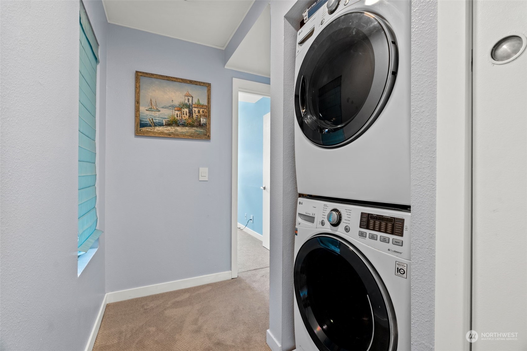 7455 Old Redmond Road, Unit 313 Redmond, WA 98052 - Photo 29 of 34 a view of a hallway with washer and dryer