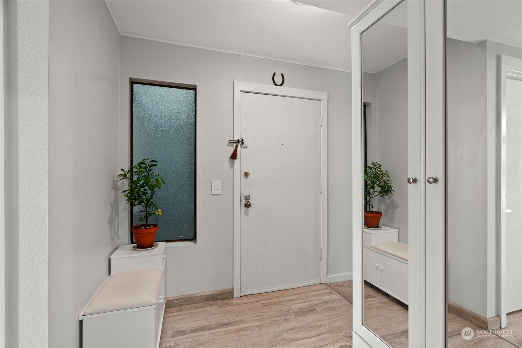 7455 Old Redmond Road, Unit 313 Redmond, WA 98052 - Photo 4 of 34 a view of an entryway with wooden floor