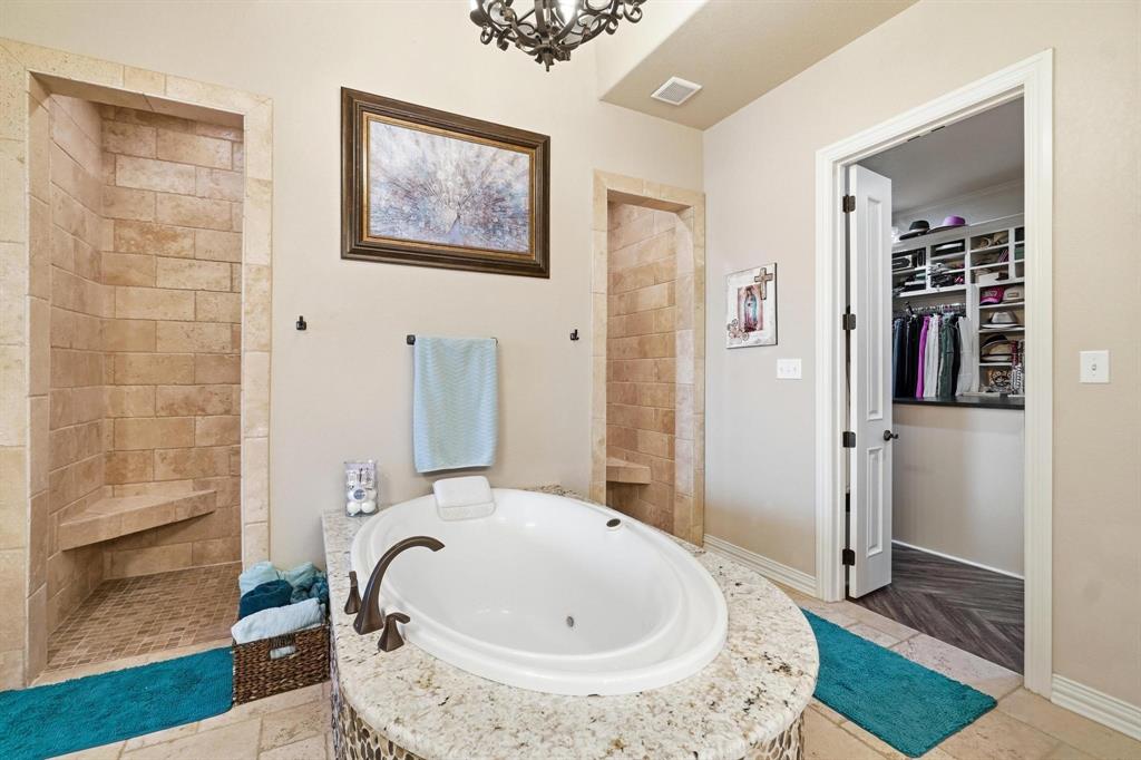 249 Rising Star Drive Abilene, TX 79606 - Photo 18 of 40 a bathroom with a tub and shower