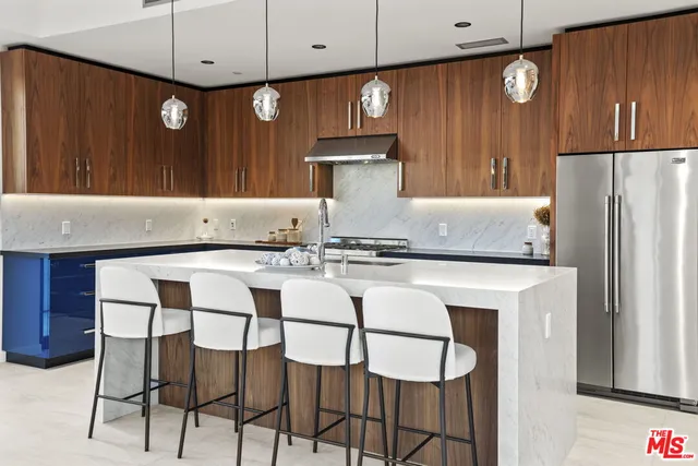 a kitchen with a sink a counter space and a window
