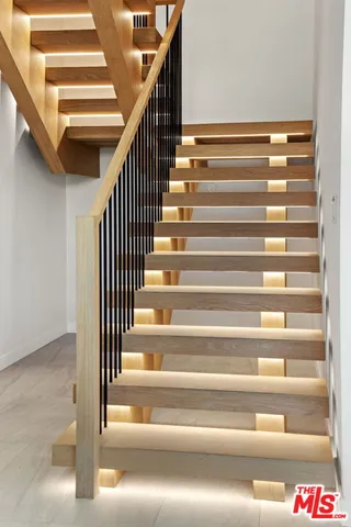 a living room with patio furniture and a table