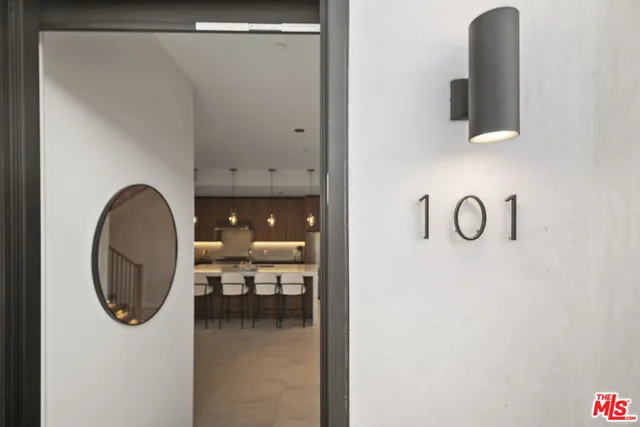 a bathroom with a mirror and a sink