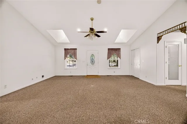 a view of a kitchen with microwave and cabinets