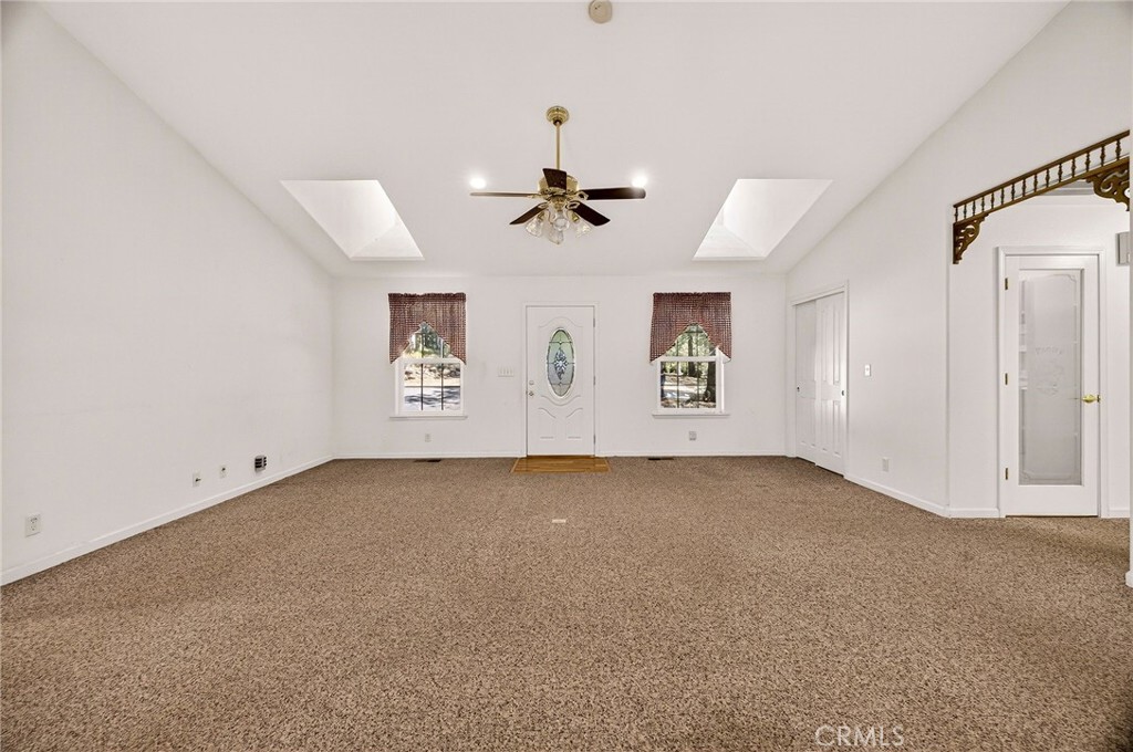 10202 Cohasset Road Chico, CA 95973 - Photo 13 of 71 an empty room with windows and fan