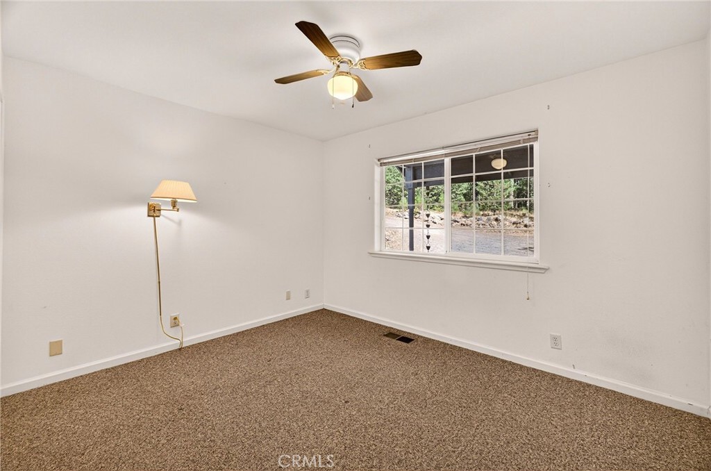 10202 Cohasset Road Chico, CA 95973 - Photo 35 of 71 en house with a ceiling fan and a window