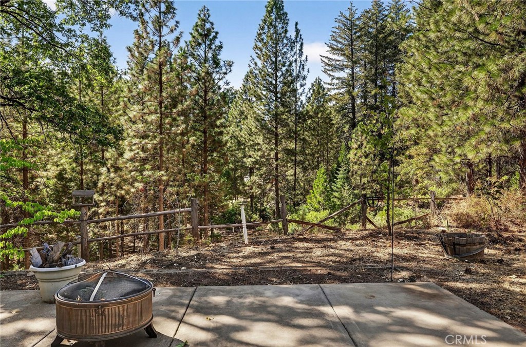 10202 Cohasset Road Chico, CA 95973 - Photo 52 of 71 a backyard of a house with fountain table and chairs