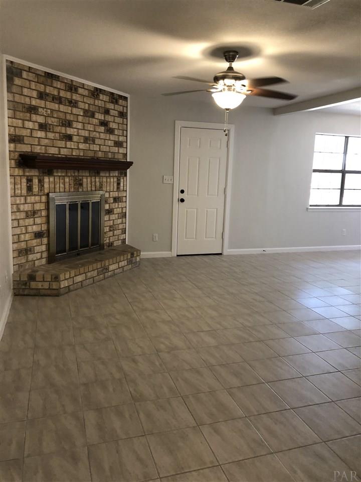 5577 Northrop Road Milton, FL 32570 - Photo 6 of 18 Den with fireplace open to kitchen