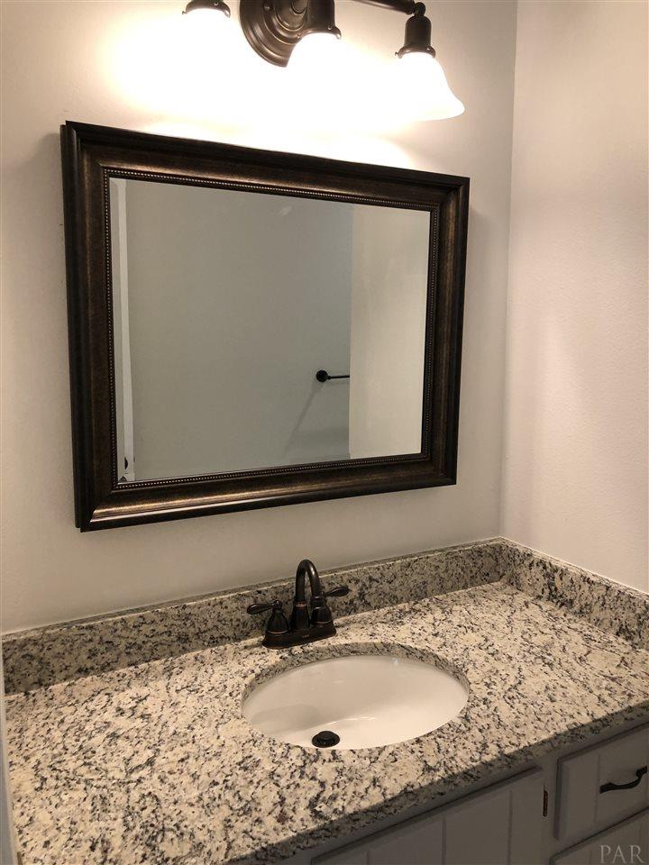 5577 Northrop Road Milton, FL 32570 - Photo 9 of 18 Renovated guest bath with granite counter tops