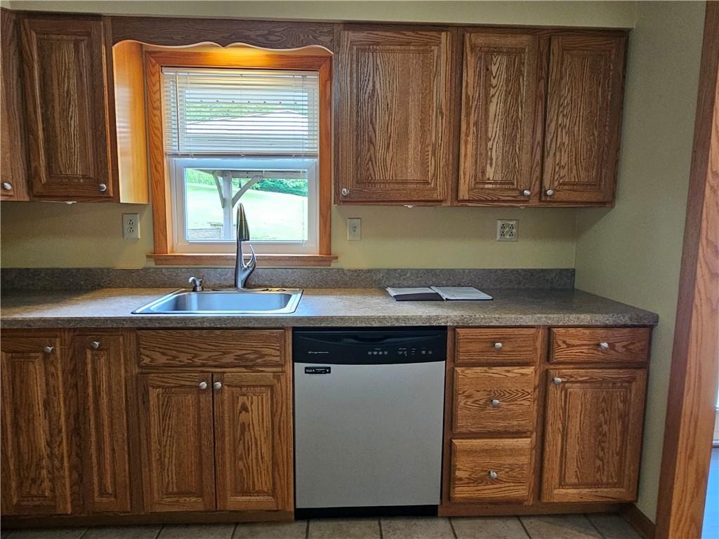 1018 Chicora Road Chicora, PA 16025 - Photo 17 of 43 a kitchen with stainless steel appliances granite countertop wooden cabinets and a sink