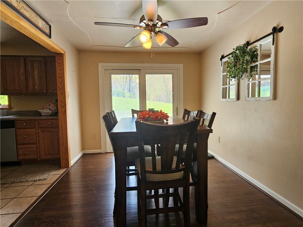 1018 Chicora Road Chicora, PA 16025 - Photo 22 of 43 a view of a dining room with furniture window and wooden floor