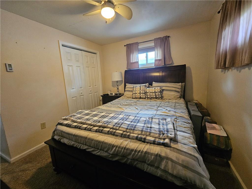 1018 Chicora Road Chicora, PA 16025 - Photo 24 of 43 a bedroom with a bed and a chandelier