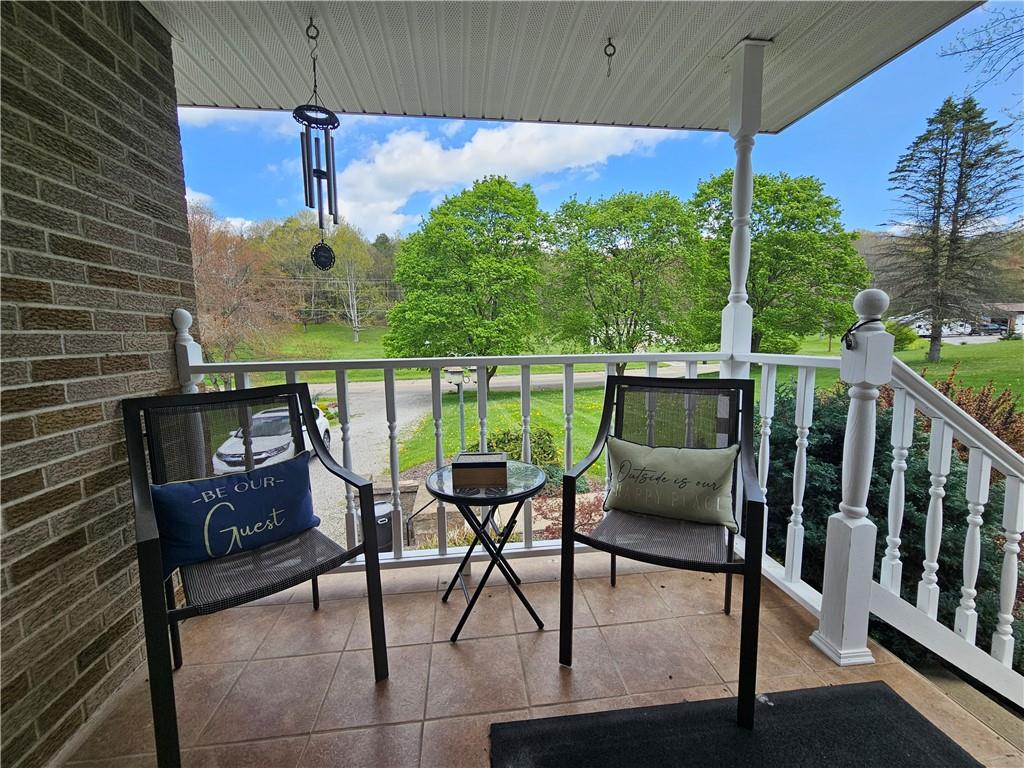 1018 Chicora Road Chicora, PA 16025 - Photo 29 of 43 a balcony with table and chairs