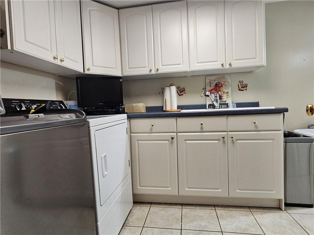 1018 Chicora Road Chicora, PA 16025 - Photo 31 of 43 a kitchen with white cabinets and white appliances