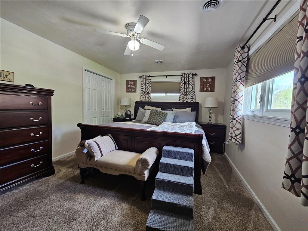1018 Chicora Road Chicora, PA 16025 - Photo 33 of 43 a bedroom with a bed a couch and dresser