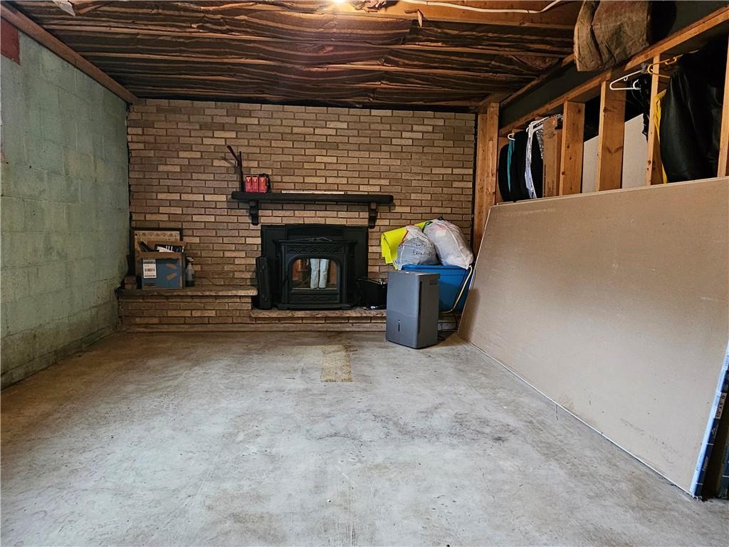 1018 Chicora Road Chicora, PA 16025 - Photo 34 of 43 a view of empty room with fireplace and fan