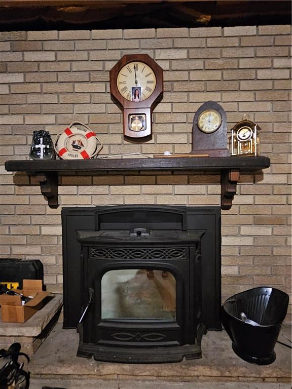 1018 Chicora Road Chicora, PA 16025 - Photo 35 of 43 a fireplace with a clock on top