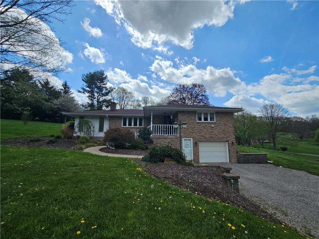 1018 Chicora Road Chicora, PA 16025 - Photo 42 of 43 a front view of a house with garden