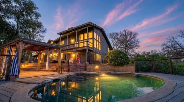 a view of swimming pool from a balcony