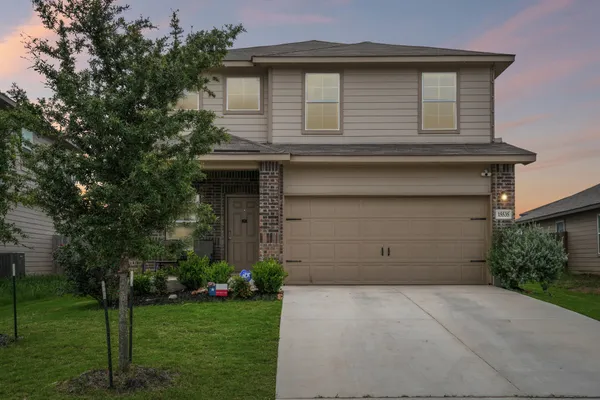 a house with a yard and garage