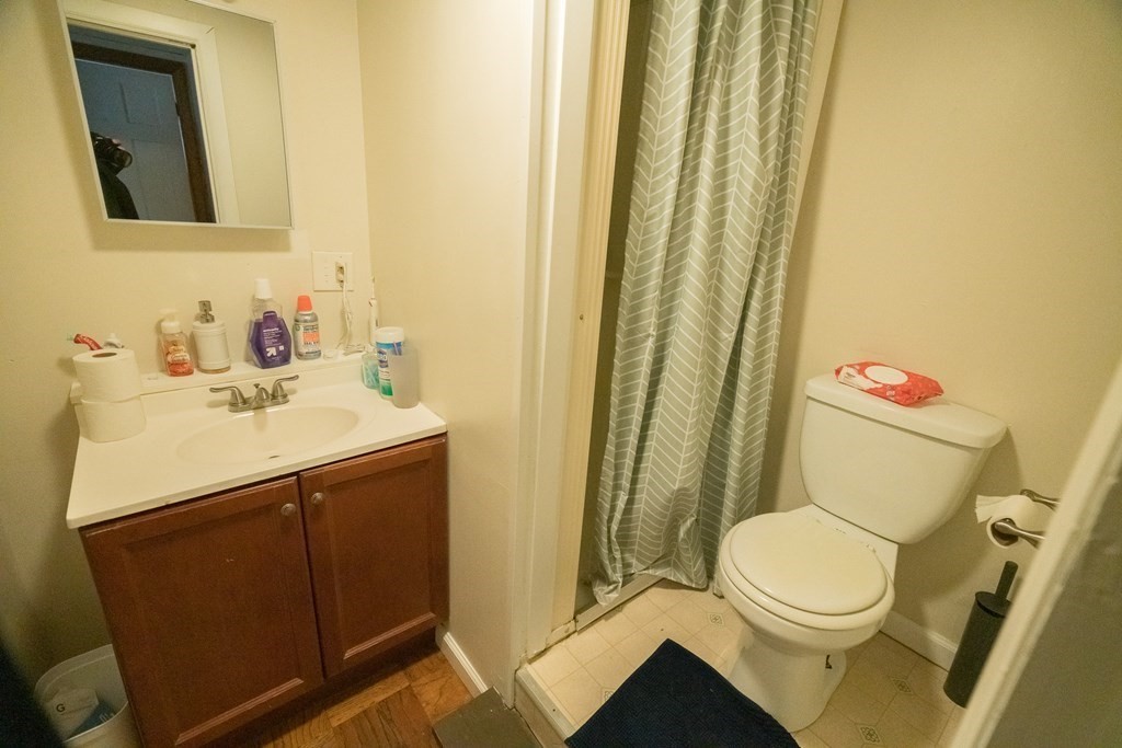 370 Pelham Road Amherst, MA 01002 - Photo 13 of 13 a bathroom with a sink a toilet and a mirror