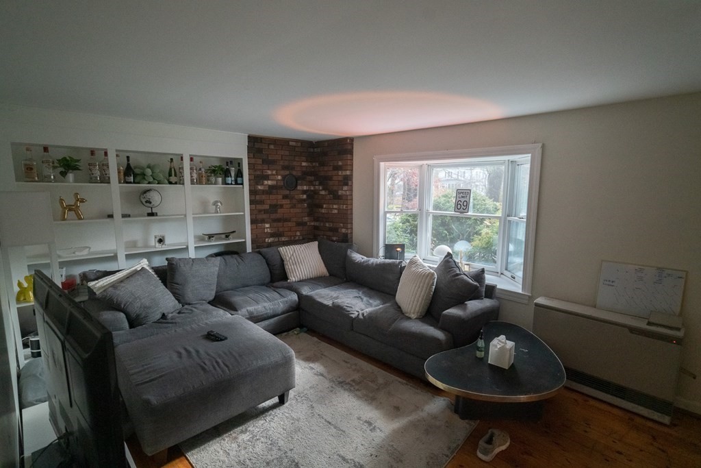 370 Pelham Road Amherst, MA 01002 - Photo 4 of 13 a living room with furniture and a large window